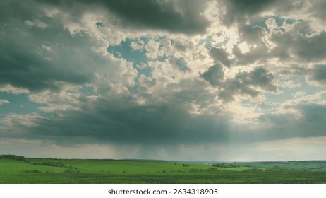 A Dramatic Cloudy Sky Over an Expansive Green Landscape Captivates the Imagination and Heart Time lapse.