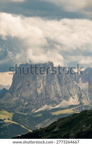 Dramatic cloudy sky over imposing peaks of the sella group, a natural landscape in the alps