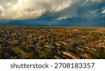 Dramatic cloudy sky over Lichfield residential suburbs and countryside