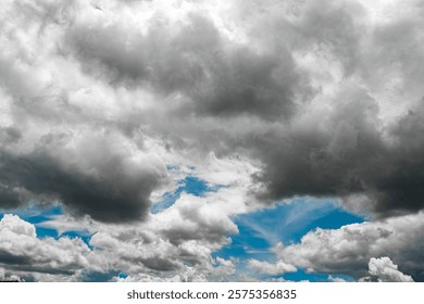 Dramatic cloudy sky with patches of blue visible.