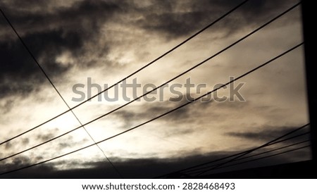 Dramatic Cloudy Sky With Powerlines
