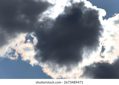Dramatic cloudy sky with sunlight breaking through clouds creating stunning rays of light highlighting natures beauty atmosphere and serene landscape