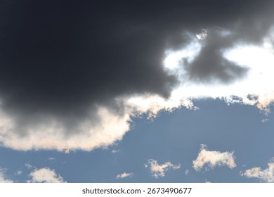 Dramatic cloudy sky with sunlight breaking through clouds creating stunning rays of light highlighting natures beauty atmosphere and serene landscape