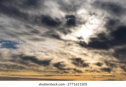 dramatic cloudy sky with sunlight breaking through dark clouds birds flying scenic nature background