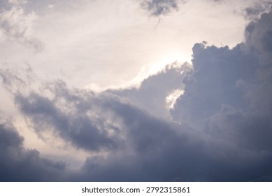 Dramatic cloudy sky with sunlight breaking through.