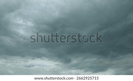 Dramatic Cloudy Sky There is a Dark Cloud Cover Overhead, creating an intense atmosphere