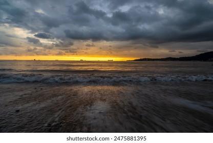 Dramatic cloudy sunset at beach