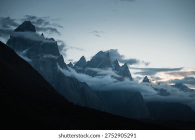 Dramatic cloudy sunset over towering trango peaks along the baltoro trek. Trango towers karakoram