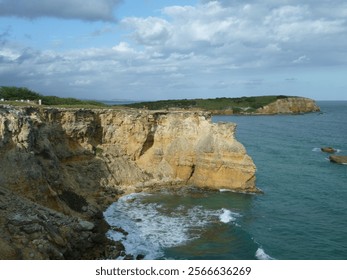 "Dramatic Coastal Cliffs with Ocean Waves and Scenic Views"