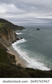 Dramatic coastal cliffs with rugged rocks and crashing waves under an overcast sky. Captures the wild ocean's power and serene beauty, showcasing nature's raw, tranquil, and scenic landscape.