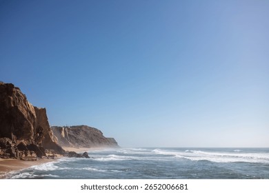 Dramatic Coastal Cliffs and Sandy Beach with Ocean Waves