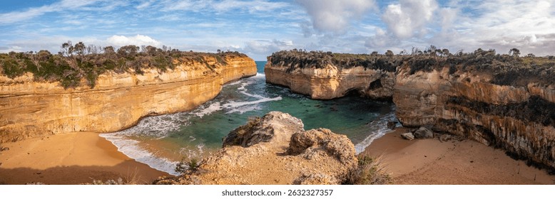 Dramatic coastal cliffs and turquoise waters at Loch Ard Gorge along the Great Ocean Road, Victoria.