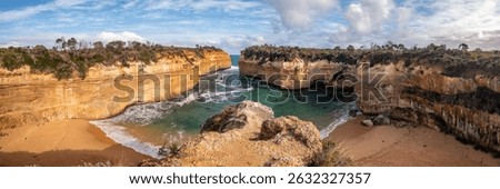 Dramatic coastal cliffs and turquoise waters at Loch Ard Gorge along the Great Ocean Road, Victoria.