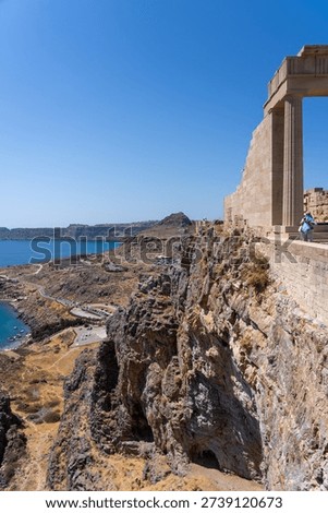 Dramatic Coastal Cliffside View, Ancient Architecture and Turquoise Sea