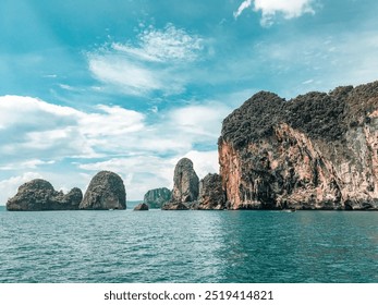 dramatic coastal limestone cliffs rising from turquoise waters under a bright blue sky, perfect for nature exploration - Powered by Shutterstock