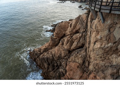 Dramatic Coastal Rocky Outcrop Overlooking Turquoise Waters   - Powered by Shutterstock