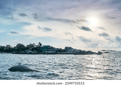 Dramatic coastal seascape with a breathtaking sunset, featuring rocky shores and a serene ocean - Powered by Shutterstock