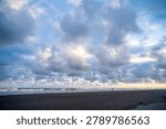 Dramatic Coastal Storm Clouds Above Black Sand Beach