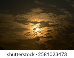 Dramatic colorful cloudscape with the sunbeam at the sunset. Sunlight through the clouds. Sunset skyscape, sunset background. Nature concept