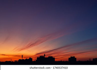 Dramatic colorful red purple to blue sunset sunrise sky landscape and line row city buildings silhouette   Natural beautiful cityscape dawn background wallpaper  Metropolis rise twilight time