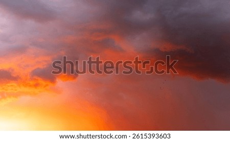 Dramatic, colorful, red-painted cloudy sky at sunset. Clouds' texture, abstract nature, background.