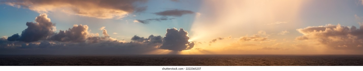 Dramatic Colorful Sunrise Sky over North Atlantic Ocean. Cloudscape Nature Background. Panorama