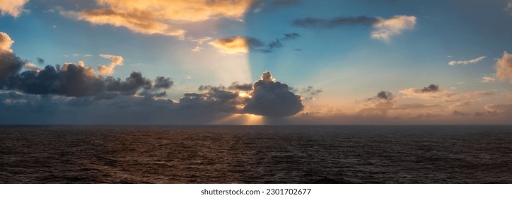 Dramatic Colorful Sunrise Sky over North Atlantic Ocean. Cloudscape Nature Background. Panorama