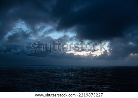 Dramatic Colorful Sunrise Sky over North Atlantic Ocean. Cloudscape Nature Background.