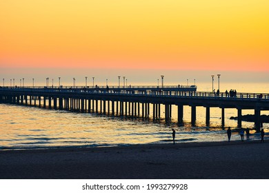Dramatic colorful sunset at famous marine pier in Baltic resort city of Palanga. Lithuania landmarks
