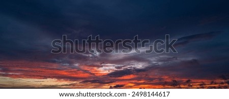 Dramatic Colorful Sunset Sky. Clouds with Sunrays. Cloudscape Nature Background. Panorama sunset sky and cloud background. Dark Clouds, Night Sky. Dark Dramatic Sky, Epic Sunset Clouds.