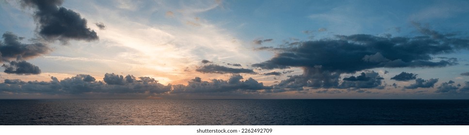 Dramatic Colorful Sunset Sky over Mediterranean Sea. Clouds with Sunrays. Cloudscape Nature Background. Panorama - Powered by Shutterstock