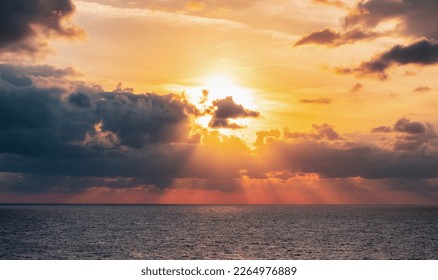 Dramatic Colorful Sunset Sky over Mediterranean Sea. Clouds with Sunrays. Cloudscape Nature Background. - Shutterstock ID 2264976889