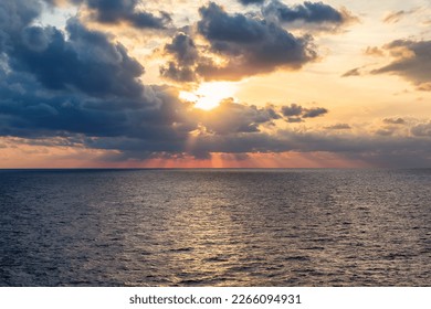 Dramatic Colorful Sunset Sky over Mediterranean Sea. Clouds with Sunrays. Cloudscape Nature Background. - Shutterstock ID 2266094931