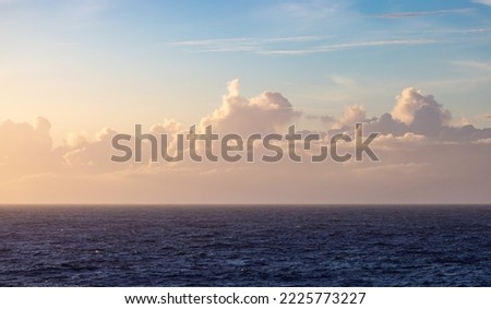 Dramatic Colorful Sunset Sky over North Atlantic Ocean. Cloudscape Nature Background.