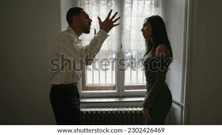 Dramatic couple shouting and yelling at each other. A young Middle Eastern man and woman having relationship troubles