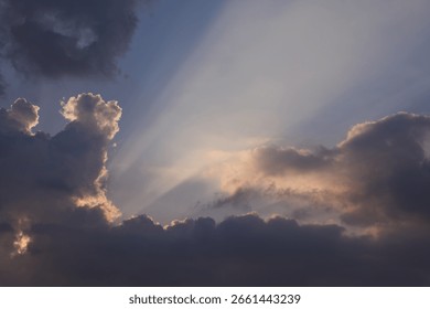Dramatic Crepuscular Rays Breaking Through Dark Clouds
