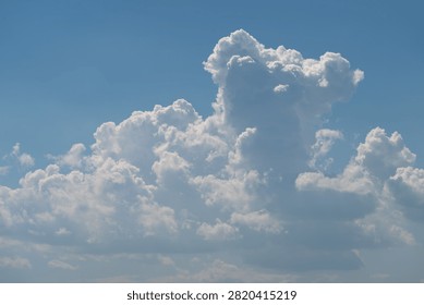 Dramatic cumulus cloud formation against blue sky