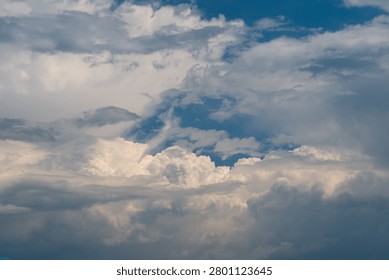 Dramatic cumulus cloudscape with layered sky