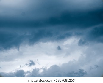 Dramatic Dark Blue Stormy Sky with Heavy Clouds Before Rain, Moody Monsoon Weather Background
