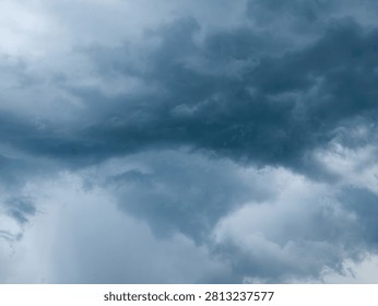 Dramatic Dark Blue Stormy Sky with Heavy Clouds Before Rain, Moody Monsoon Weather Background