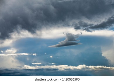 Dramatic dark clouds with blue sky