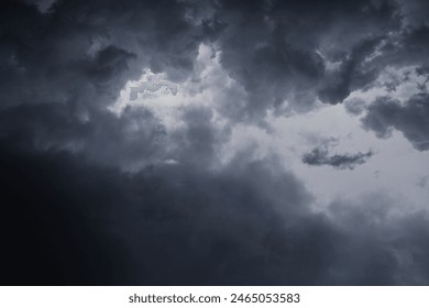 dramatic dark clouds in the sky, dark storm clouds in a dark sky before rain,beautiful landscape with cloudy sky