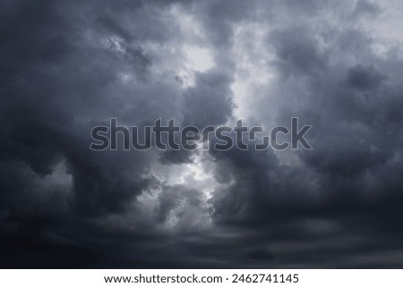 dramatic dark clouds in the sky, dark storm clouds in a dark sky before rain,beautiful landscape with cloudy sky