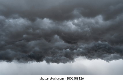 Dramatic dark grey clouds sky with thunder storm and rain. Abstract nature landscape background. - Shutterstock ID 1806589126