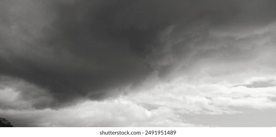 Dramatic dark rain clouds in black and white in Pevensey East Sussex UK 21 July 2024 - Powered by Shutterstock
