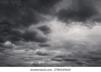 Dramatic dark storm clouds gathering in the sky creating an ominous atmosphere