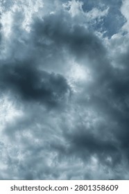Dramatic dark storm clouds gathering across the sky, creating a powerful and moody atmosphere before rainfall. The dense cloud formations and deep gray tones highlight changing weather conditions, nature’s intensity, and the beauty of an approaching storm. Ideal for weather, climate, environment, meteorology, and natural background concepts.