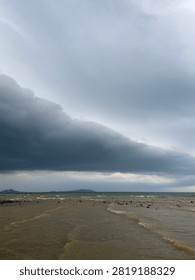 Dramatic Dark Storm Clouds Over the Sea Before Rain with Coastal Horizon Landscape