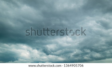 Dramatic dark storm clouds sky