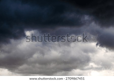 Dramatic dark storm clouds in the sky.